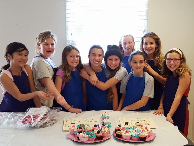 Teens group picture after baking cupcakes