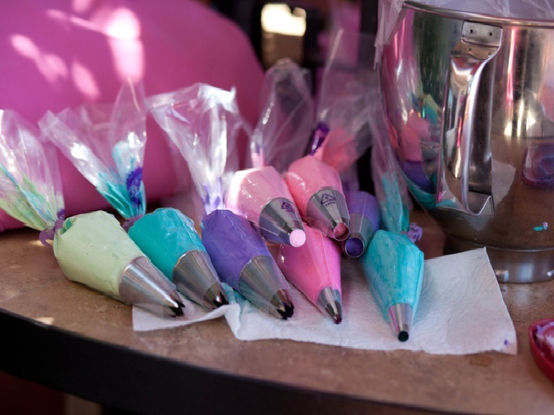 Colorful frosting inside piping bag