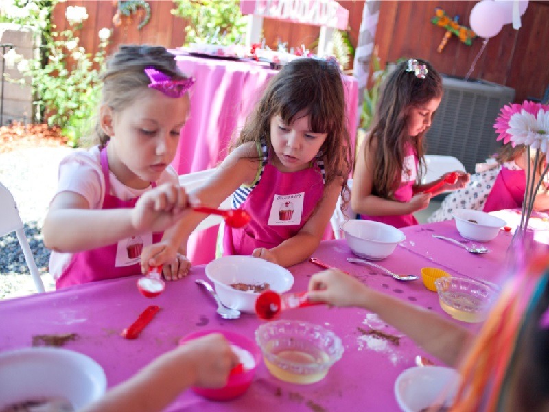 Kids measuring ingredients