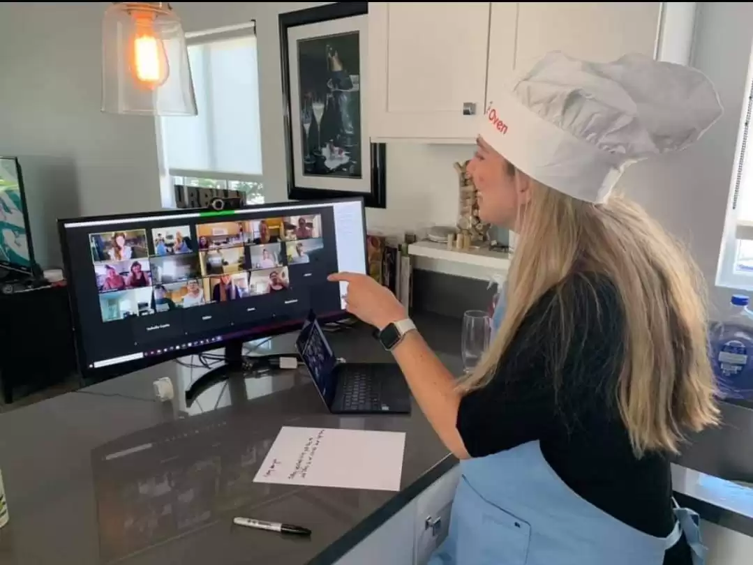 Person in front of a laptop with zoom meeting open